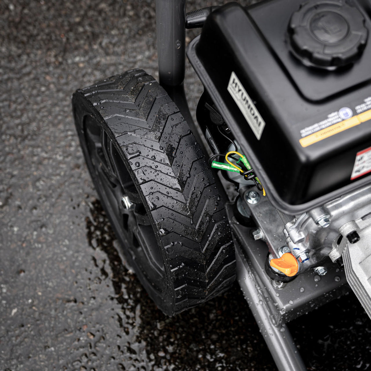 Close up view if the Hyundai Petrol High-Pressure Washer in use.