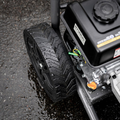 Close up view if the Hyundai Petrol High-Pressure Washer in use.